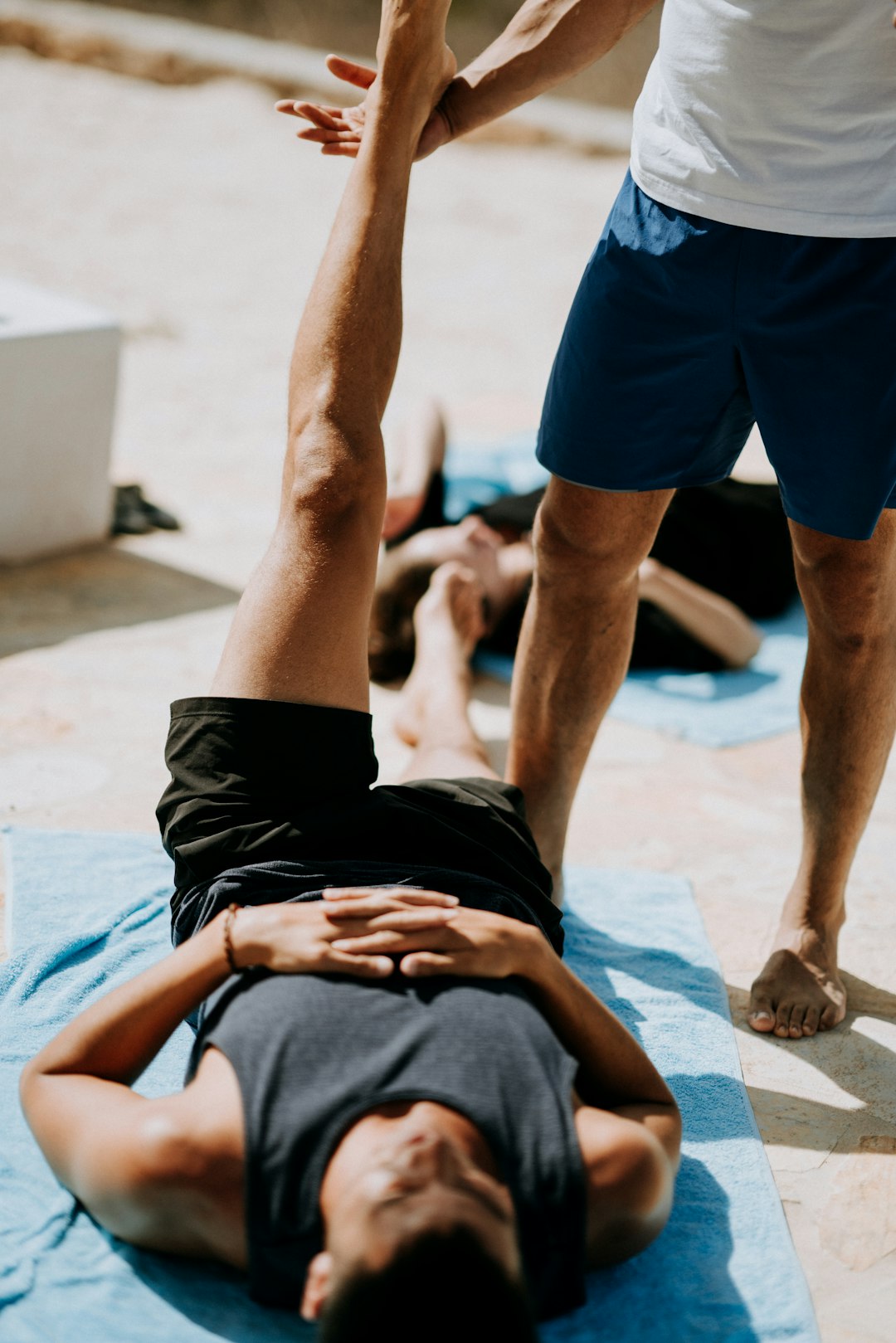 Men stretching together